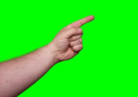 Pointing hand in front of a green screen 写真素材