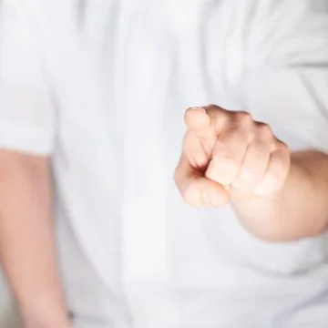 Pointing hand gesture Stock Photos