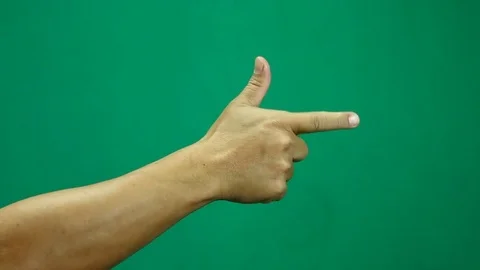 Pointing hand with green background Stock Footage 83675931