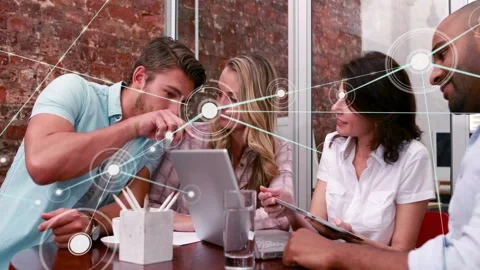 Pointing man guiding team studying growing node web in office with tablet, in Stock-Footage 331736078