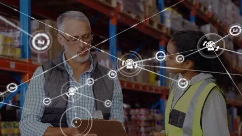 Pointing manager and listening worker checking clipboard in warehouse as data Stock Footage 333963244
