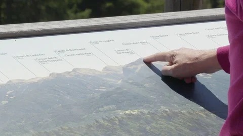 Pointing at a Peak on outdoor Mountain Map Video stock 76737304