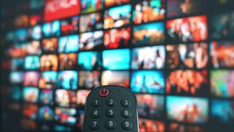 Pointing a remote at a wall of content. Stock Footage 315542596