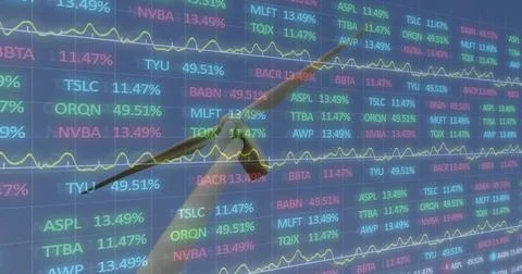 Pointing right hand and forearm in dark suit cuff, indicating tickers and charts Stock Photos