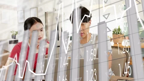 Pointing at screen causing translucent charts, pair comparing numbers and taking Stock Footage 333552638