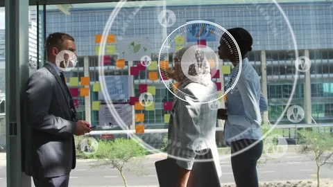 Pointing team collaborating at office glass wall in suit, hijab, blouse with Stock Footage 334039345