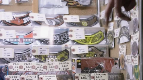 Pointing at Various Items for Sale at Flea Market Stock Footage 104690569