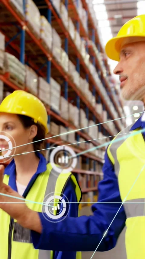 Pointing workers in hard hats walking racks aisle with data overlays, checking Stock Footage 330286030