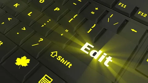 Pointing on yellow glowing Edit key Stock Footage 100561611