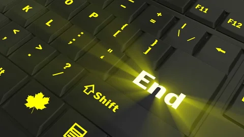 Pointing on yellow glowing End key Stock Footage 100561766