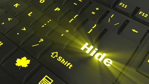 Pointing on yellow glowing Hide key Stock Footage 100636020