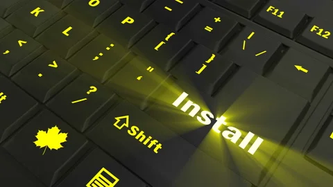 Pointing on yellow glowing Install key Stock Footage 100561862