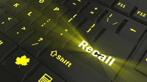 Pointing on yellow glowing Recall key Stock Footage 100582786