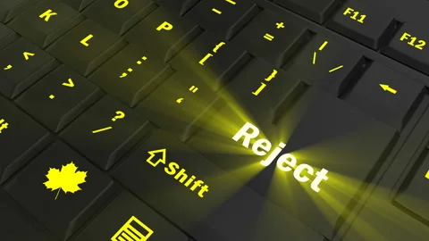 Pointing on yellow glowing Reject key Stock Footage 100637308