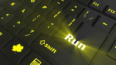 Pointing on yellow glowing Run key Stock Footage 100608983