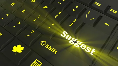 Pointing on yellow glowing Suggest key Stock Footage 100562293