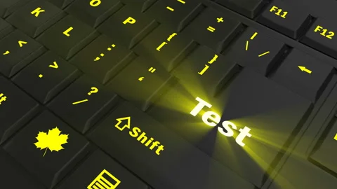 Pointing on yellow glowing Test key Stock Footage 100583323