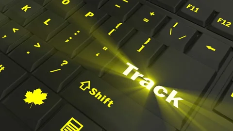 Pointing on yellow glowing Track key Stock Footage 100637444