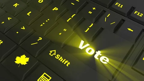 Pointing on yellow glowing Vote key Stock Footage 100609243
