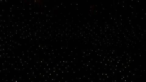 Points of light in absolute darkness like a starry sky Stock Photos