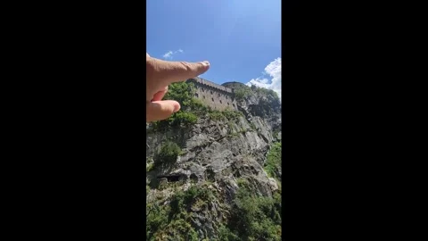 Points to the mountain with his finger on his hand Stock Footage 289673746
