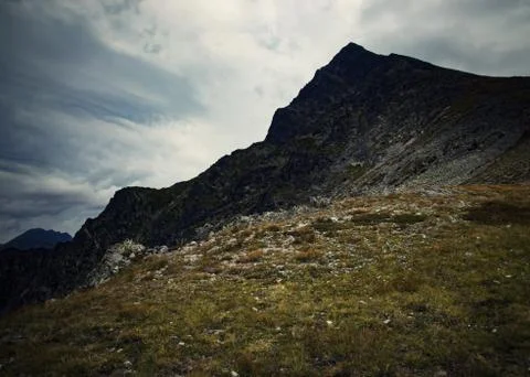 Pointy mountain top with dramatic sky Stock Photos