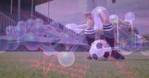 Poising player legs in striped socks, soccer ball on pitch before stands, mol Stock Photos