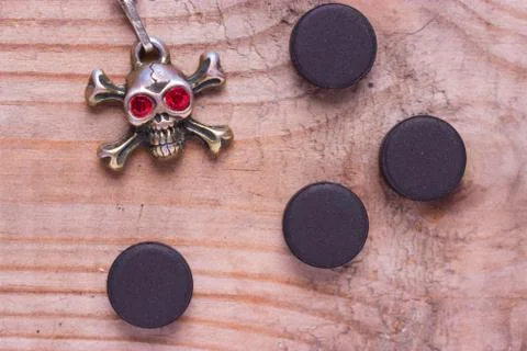 Poison pill on a table Stock Photos