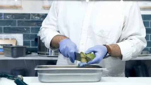 Poke chef cutting raw organic avocado pieces. Veggie tasty diet concept. Video stock 128926341
