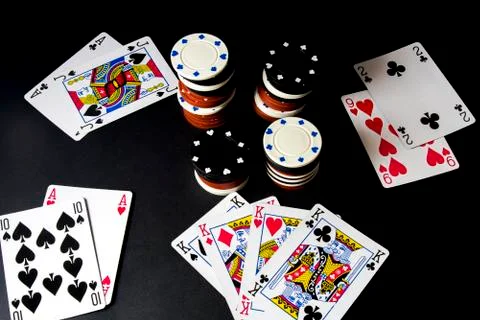 Poker cards and stack of chips isolated on black. All in, four of kings, poke Stock Photos