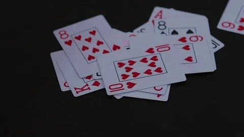 Poker cards falling to the black table Stock-Footage 77041929
