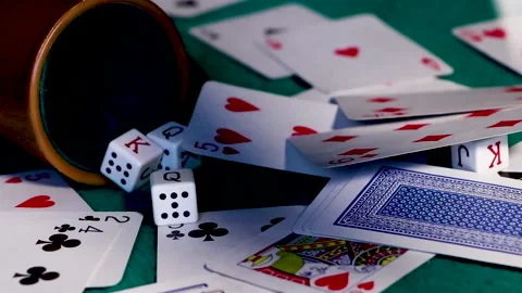 Poker cards falling on the gaming table Stock Footage 147948021