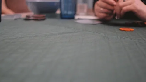 Poker chip spins fast on the table Stock Footage 124164474