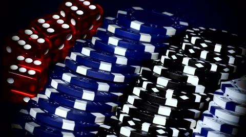Poker chips and dice close up travelling shot Stock Footage 64708650
