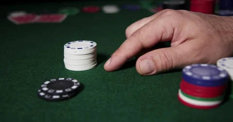 Poker chips and mans hands on the table Stock Footage 243258418