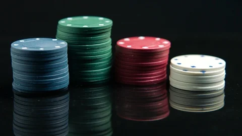 Poker chips on the black mirror surface Stock Footage 94065335