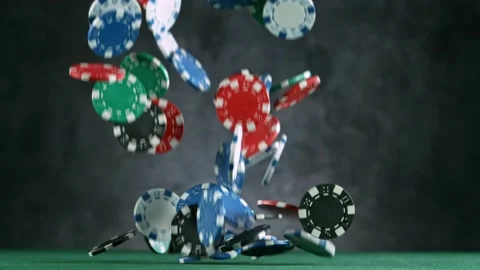 Poker chips falling on casino table, slow motion. Stock Footage 130532957