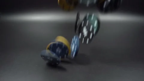 Poker Chips Falling in Slow Motion on black background Stock Footage 104726044