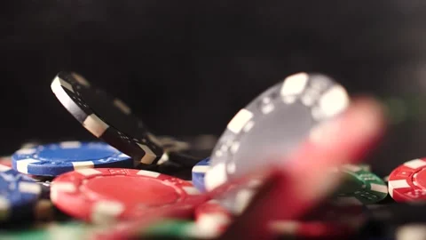 Poker chips falling in slow motion isolated on black winning smoke swirling Stock Footage 205535689