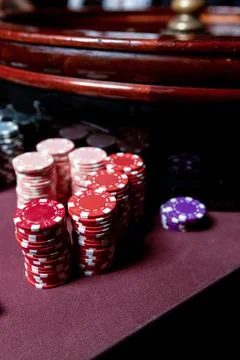 Poker Chips on a gaming table with dramatic lighting Stock-Fotos