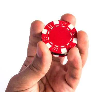Poker chips in hand Stock Photos