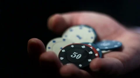 Poker chips in a man's palm close up Stock Footage 295721855