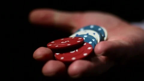 Poker chips in a man's palm Stock Footage 295722170