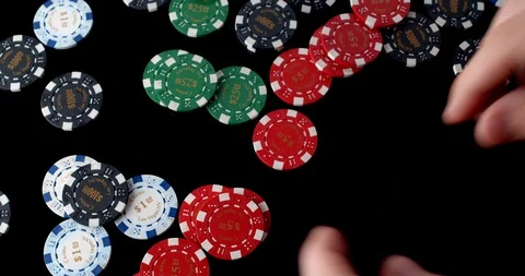 Poker chips in multiple colours removed in groups Stock Footage 112332596
