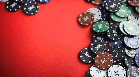 Poker chips on a red table Stock Photos