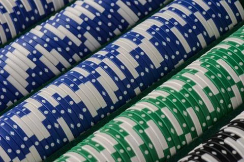 Poker chips in a row close up Stock Photos