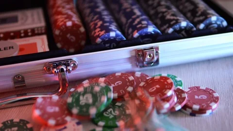 Poker chips slowly fall onto the table next to the chip box. 4к Stock Footage 124277497