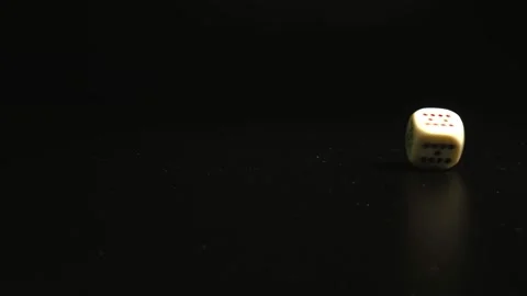 Poker dice falling and turning around on black surface. Close-up of Rotating Stock Footage 144339908