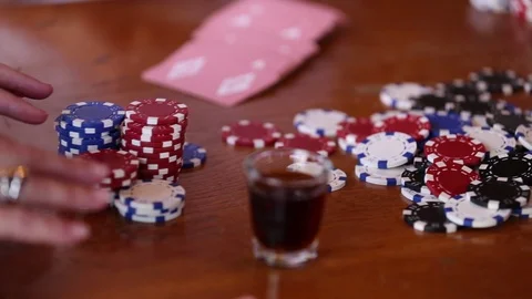 Poker game played on wooden table. pan Stock Footage 106820737