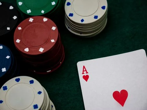 Poker game table, single ace card score with stack of playing chips Stock Photos